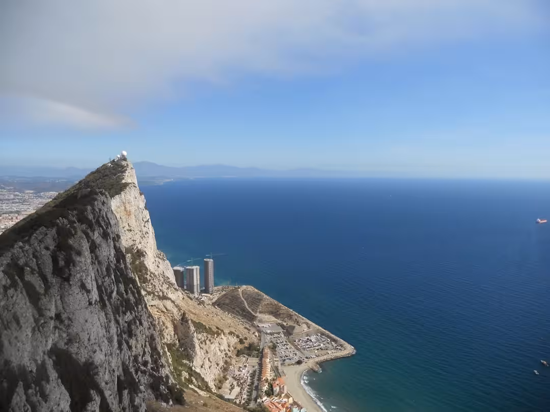 a city on a cliff by the ocean