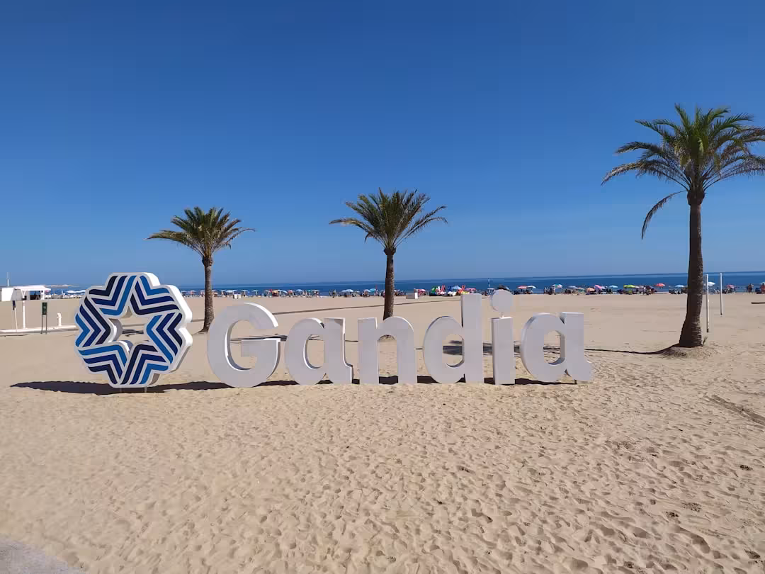 a sign that is sitting in the sand