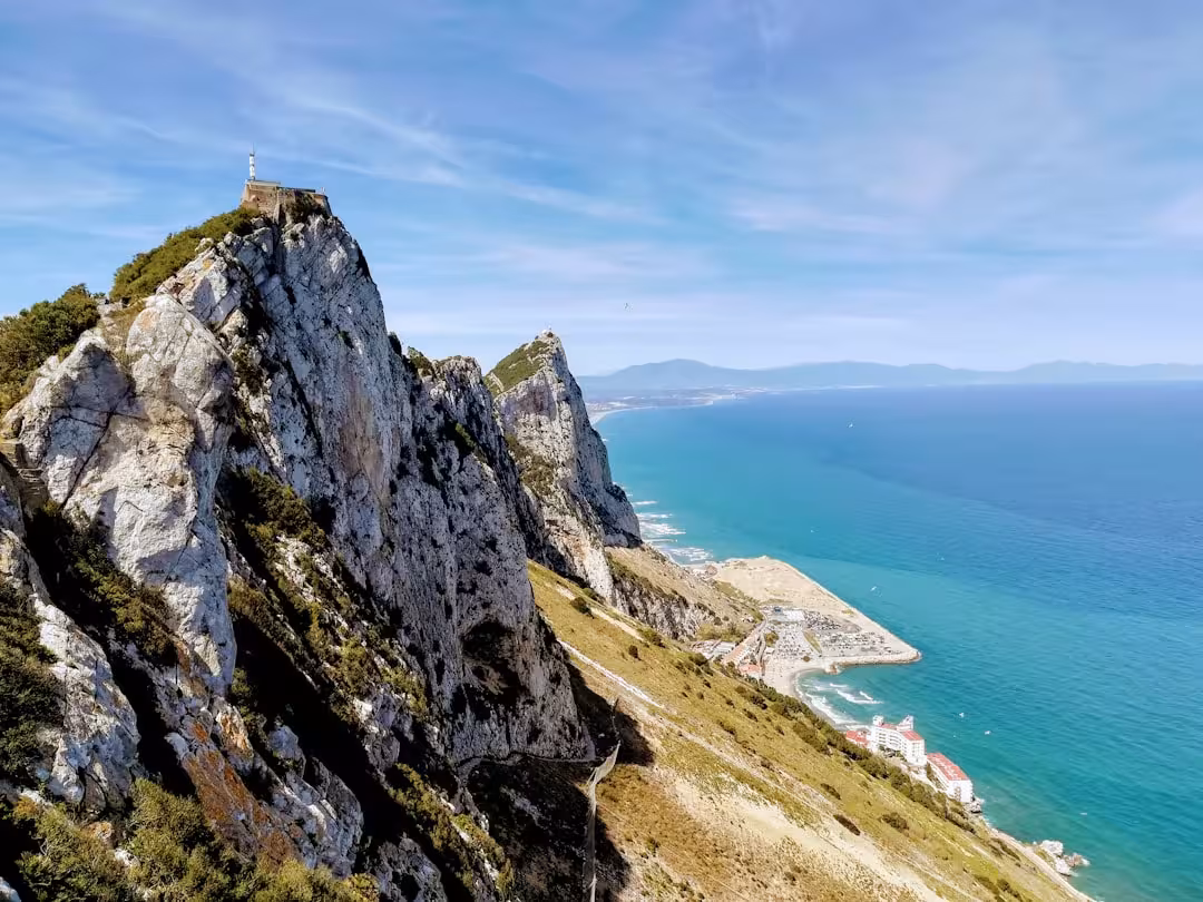mountain near body of water during daytime