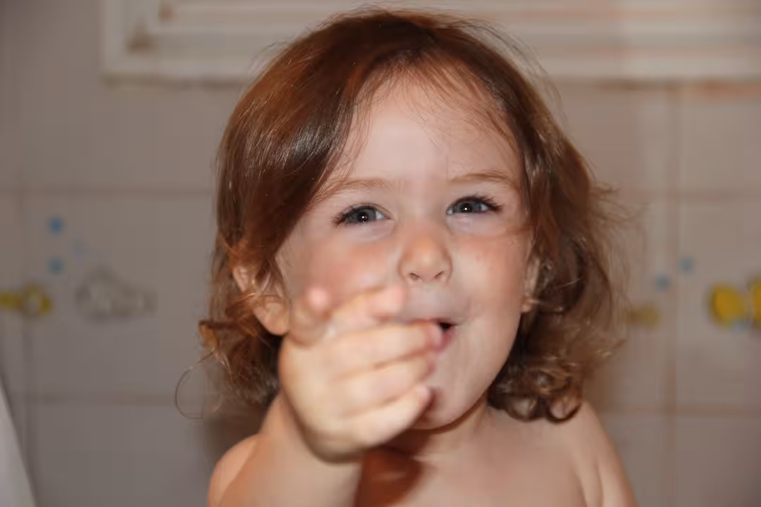 girl with brown hair smiling
